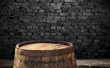 Old wooden barrel on a brown background