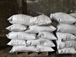 Chemical fertilizer The product stock is packed in sacks, stacked in the warehouse, waiting for delivery.