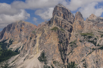 View of Sassongher mountain, 2665 m, dominates the towns of Corvara & Colfosco in Badia valley with Gardena pass on the left, seen from Piz La Ila mountain, Puez group, Dolomites, South Tirol, Italy.