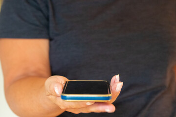 Female holding smart phone