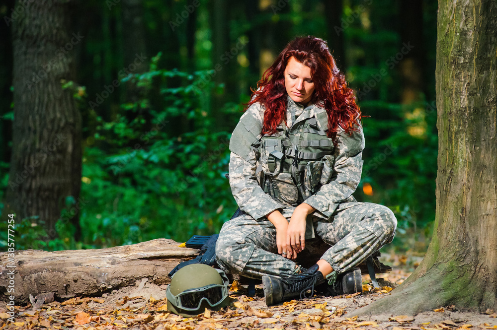 Wall mural Female soldier in the forest