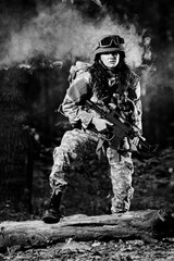 Female soldier in the forest