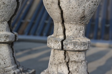 a cracked cement pillar