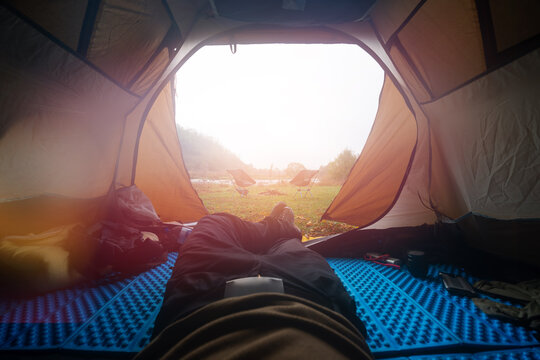 Inside The Tourist Tent, First Person View. Sun Glow Copy Space. Camping Near The River. Folding Chair And Table. Tourism And Hobby.