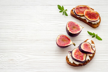 Canape or sandwich with figs and cheese, overhead view