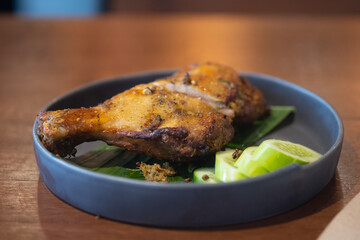 Grilled herb chicken style Thai ancient, chopped served with slice cucumber