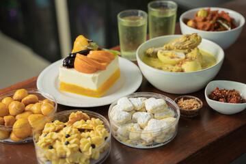 A wide variety of special dishes to celebrate Eid, cakes, cookies with pineapple filling, syrup drinks, and Chicken Opor