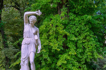Amazona white marble sculpture made by  Pirilli, surrounded by green vegetation in Carlos Thays park, Buenos Aires, Argentina