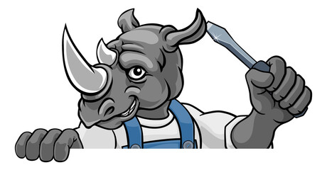 A rhino electrician, handyman or mechanic holding a screwdriver and peeking round a sign