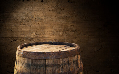 Old wooden barrel on a brown background