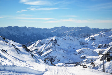Beautiful landscape of winter mountains. The slope of the ski resort on a clear day.