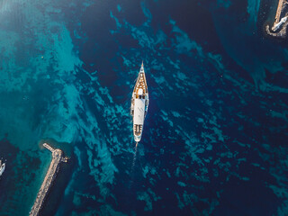 Aerial top view of CGN's boat shot using a drone over the Leman Lake and its textures in Geneva,...