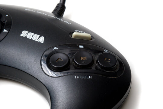 London, United Kingdom, 21st September 2020:- A retro Sega Mega Drive 16-bit gaming console's controller isolated on a white background