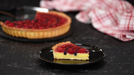 Piece of berry tart with pudding and jelly.
