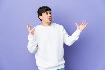 Fototapeta premium Young cool man screaming to the sky, looking up, frustrated.