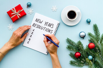 2021 New Year's resolutions with Christmas decorations. Overhead view