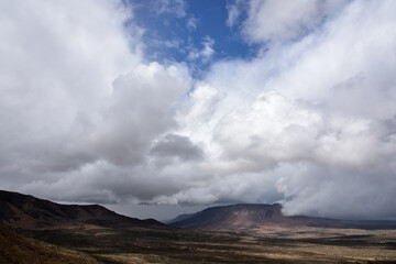 Thunder storm clouds building up in the arid semi-desert Karoo landscape in South Africa