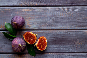 Fresh figs with green leaf. Mediterranean fruit background