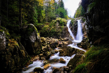 Wild waterfall in the Carpathian mountains of Romania
