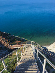 Obraz premium Stairs to the beach from the mountain