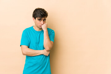 Young cool man who feels sad and pensive, looking at copy space.