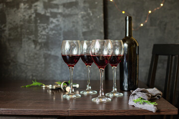 red wine in a glass festive table setting christmas holidays party new year meal on the table tasty serving size portion top view copy space for text food background rustic