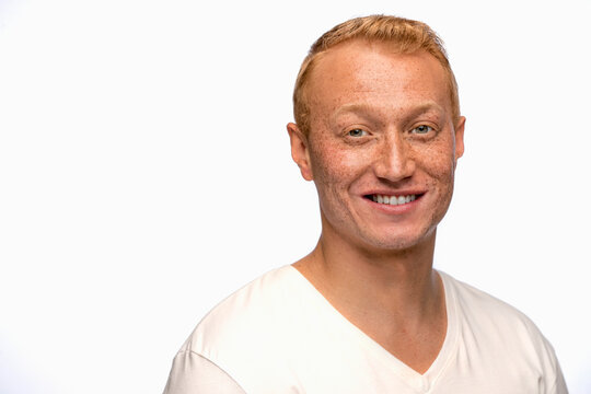 Portrait of young man looking at camera with smile