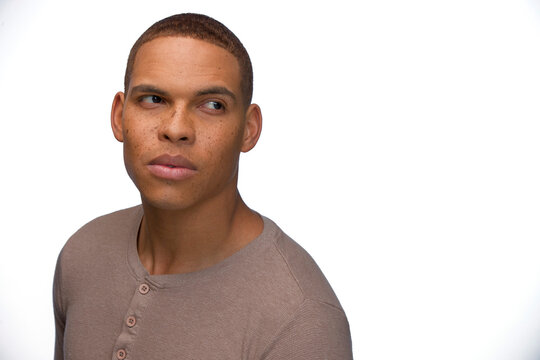 Portrait of young black man looking off camera