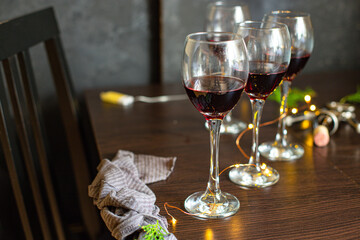 red wine in a glass festive table setting christmas holidays party new year meal on the table tasty serving size portion top view copy space for text food background rustic