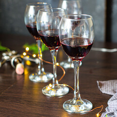 red wine in a glass festive table setting christmas holidays party new year meal on the table tasty serving size portion top view copy space for text food background rustic