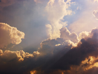 Fototapeta na wymiar Dramatic sunlight in evening stormy sky