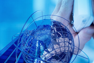 携帯電話と地球儀の合成