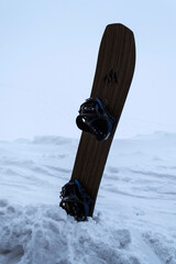 Snowboard on an isolated background in the snow.