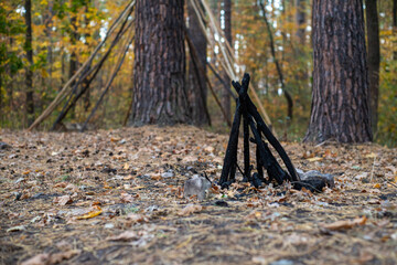 Photo of an abandoned teepee in the woods