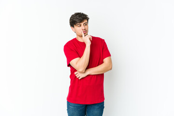 Fototapeta premium Young cool man looking sideways with doubtful and skeptical expression.