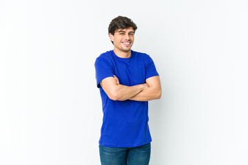 Young cool man who feels confident, crossing arms with determination.
