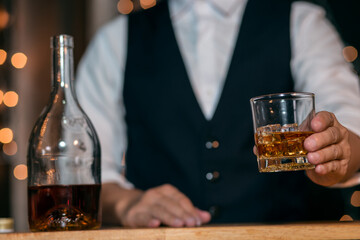 Barman pouring whiskey whiskey glass beautiful night
