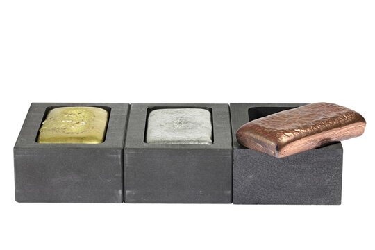 metal bars in graphite molds isolated on white background