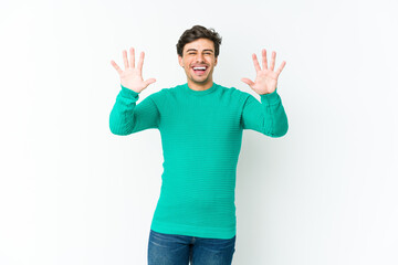 Naklejka premium Young cool man showing number ten with hands.