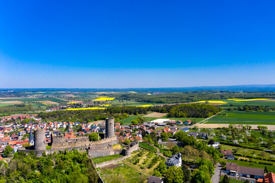 Germany, Hesse, Munzenberg, Helicopter view of Munzenberg Castle and surrounding village in summer