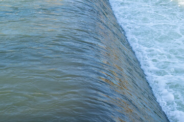 Rocks in the riverbed blue background summer