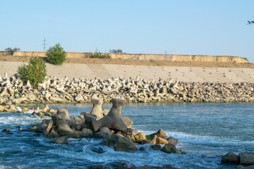 Rocks in the riverbed blue background summer