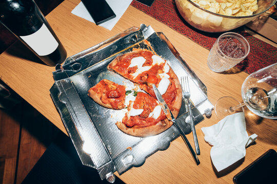 Pizza slices on table during party at home