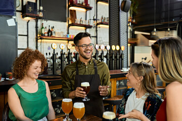 Waiter serving craft beer for female friends in a pub