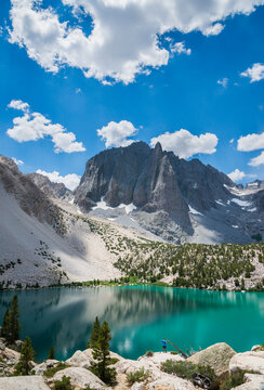 Man standing in front of Temple Crag with turquoise colored Second Lake in foreground