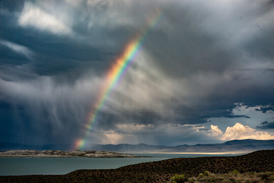 Scenic view of rainbow over Paoha Island at Mono Lake