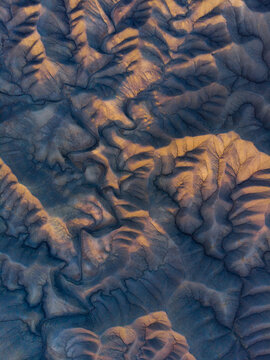 Aerial view of badlands and otherworldly textures