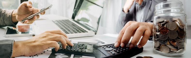 businesswoman hand using smart phone, tablet payments and holding credit card online shopping, omni channel, digital tablet docking keyboard computer at office in sun light