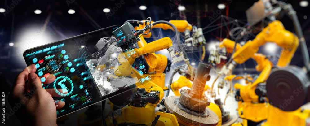 Poster Engineer hand using digital tablet and checking welding robotics automatic arms machine. Augmented reality in intelligent factory  industrial with monitoring system software.