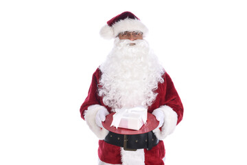 Fototapeta na wymiar Senior man in traditional Santa Claus costume holding white wrapped present on a red tray. Isolated on white.